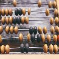 vintage-wooden-abacus-old-board-surface_154156-9464